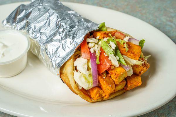 MEDITERRANEAN Seasoned Grilled Chicken in Pita Bread, Topped with Lettuce, Tomatoes, Red Onions, & Feta Cheese. Side of Tzatziki Sauce.