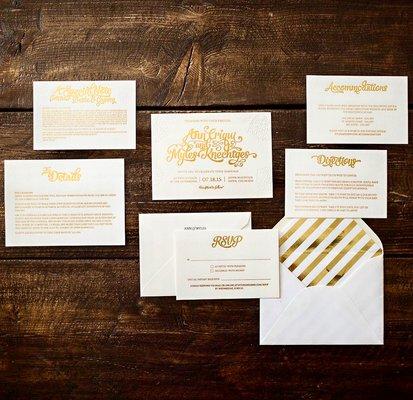 Luxe letterpress wedding invitation suite featuring custom lettering, gold foil stamp, and blind deboss