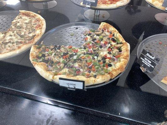 view of freshly-made pizzas