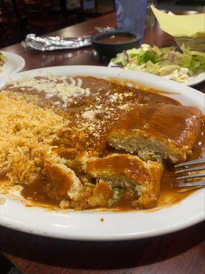 Pork tamale lacking pork and mostly masa and corn kernels, paper thin cheese enchilada, flavorless rice and beans.