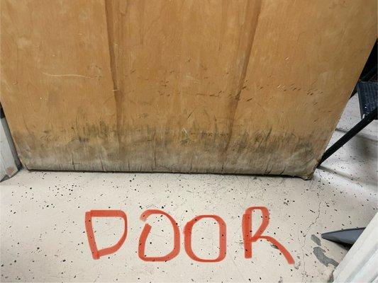 Damaged door from water tank explosion