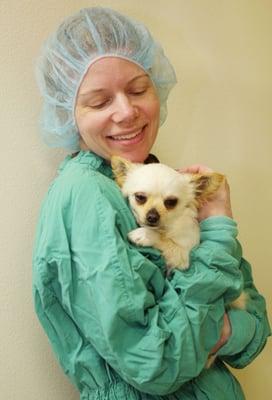 A very sweet and satisfied Spay/Neuter Clinic Participant snuggles her surgeon post-operatively.