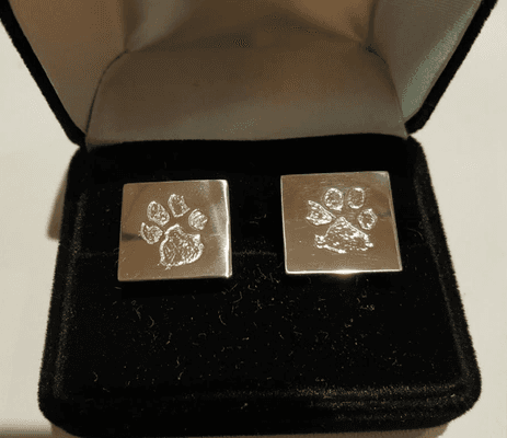 Custom cufflinks in 14kt palladium white gold, with puppy prints