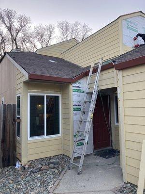 The crew installing the new siding