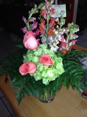 This is their 2ND ATTEMPT - only ONE hydrangea with a rose stuck in the middle; ferns(??!); and the wrong vase.