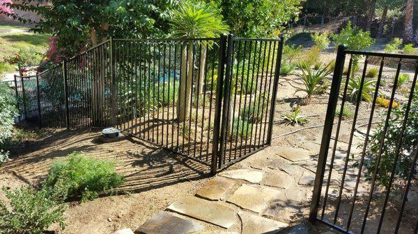 5 feet high rod iron fence with walking gate