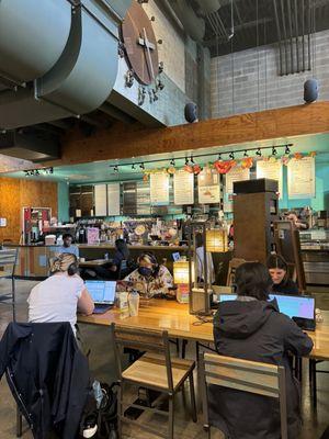 Lots of communal tables with plug outlets.