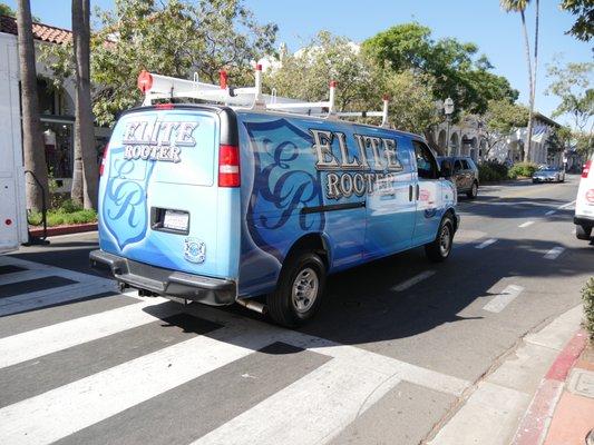 Elite Rooter van on the move, delivering professional plumbing services across the city.