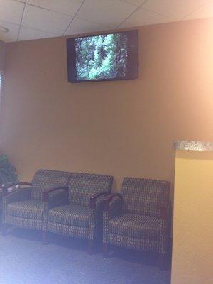 Relaxing video and comfy chairs in waiting room.