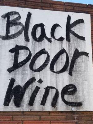 Front sign for Black Door Wine Company.