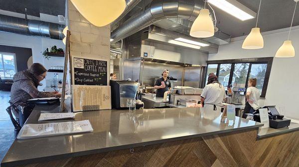 Open kitchen. Owner Emran Chowdbury is pictured in center.