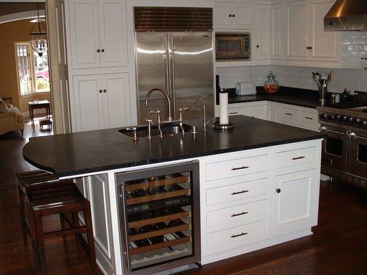 Soapstone International: Oiled Soapstone Kitchen Countertop offset with modern white cabinets