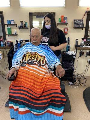 Nancy's Dad Alvaro Barrera and Granddaughter Lizette. She is 4th generation Barber