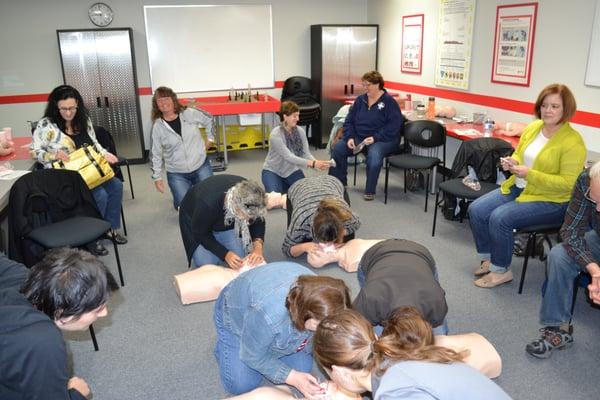 AH+RT Instructor Taneka teaching Adult/Infant CPR, AED & First Aid to the teachers of  Archbishop Howard.