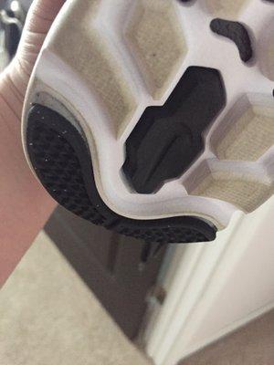 Heel rubber peeled up on new shoes PRIOR to fixing. Now they're perfect.