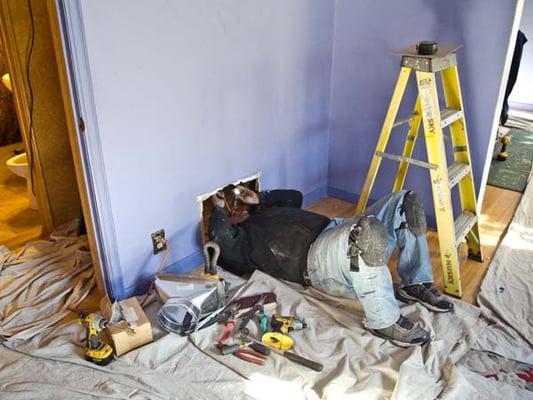 The Perfect Air crew removing my old floor furnace.