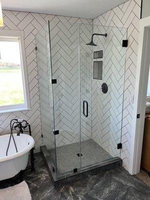 Corner 90 Miter Edge Frameless Shower Enclosure. Corner Glass to Glass Clamps and Square Tiaga Wall to Glass Clampls used for strength.