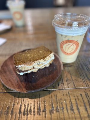 Pumpkin streusel bread and an iced oat milk latte with pumpkin cold foam~