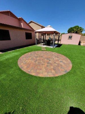 synthetic grass with center paver circle