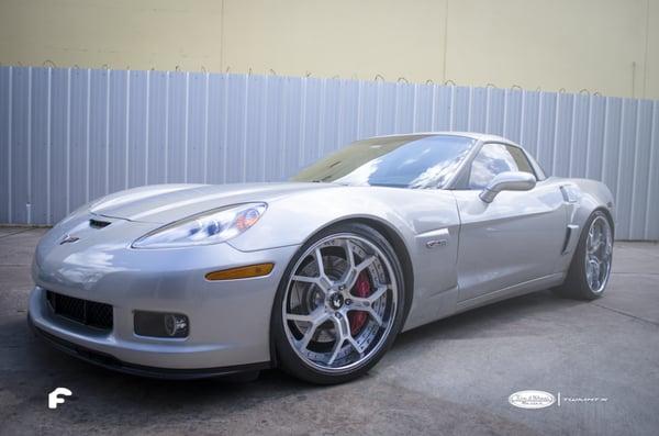 Chevrolet Corvette Z06 with custom Forgiato Wheels sitting on Pirelli P Zero Nero tires.