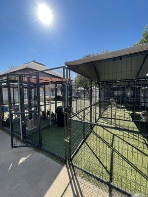 Out door play pen is in the back underneath the trees and canopies.