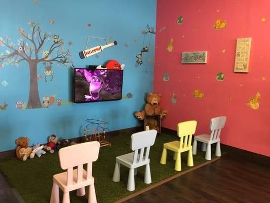 Small area for kids to keep busy while adults are availing their vouchers.