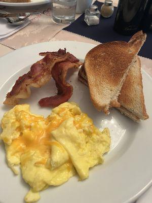 Cheesy eggs, bacon, and toast