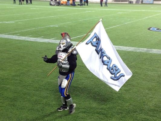 Gridiron, the mascot for the Orlando Fantasy, draws the finger pistol on the fans at the Citrus Bowl.