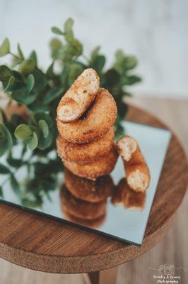 These hot and fresh mini -donuts will melt in your mouth!-- The cinnamon sugar flavore is featured above.