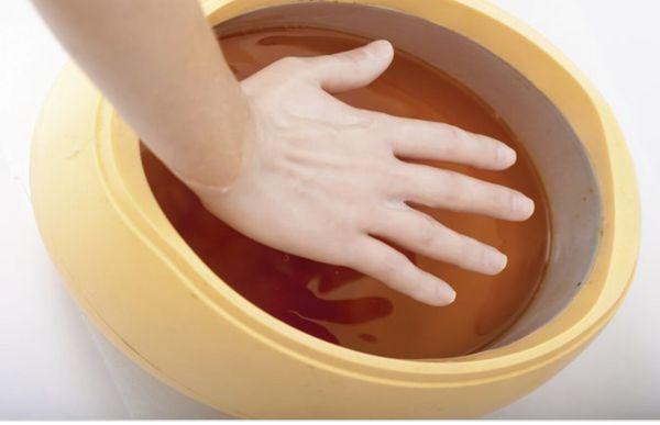 Paraffin hand dip with massage. Helps restore moisture and remove dry skin.