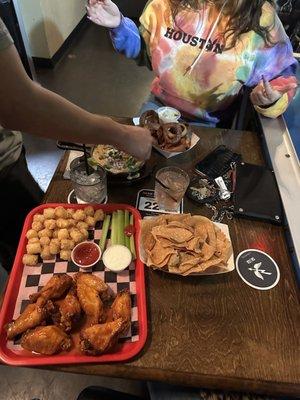 wings, queso, and onion rings