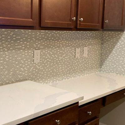 Some more backsplash! Tesoro in color Glacier Ice, and a diamond grout. Once those under cabinet lights are in, it will really shine