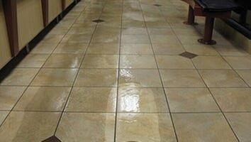 Tile and Grout floors being High Pressure cleaned with specialty machinery