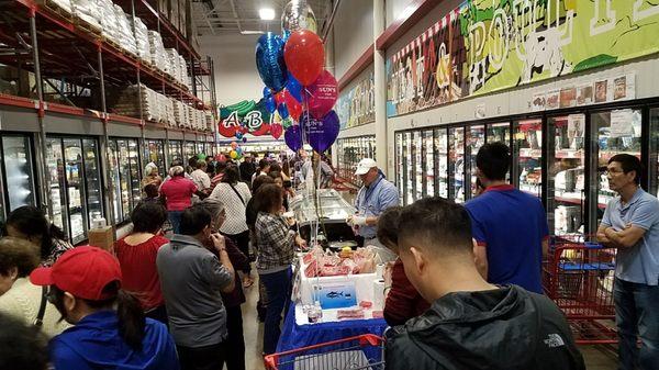 tons of people at the food festival in the store