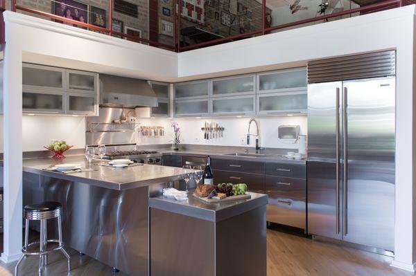 Loft style Stainless Kitchen with framed glass accebts