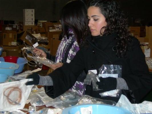 Volunteers from throughout the Bay Area help sort medical supplies donated by hospitals