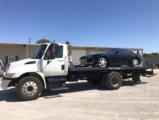 Specialty cars being towed