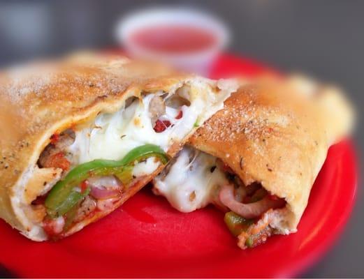 Italian sausage and green pepper calzone. Added pepperoni and onion. My favorite.