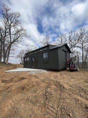 Custom cabins fully finished available! Congratulations Julie! Grey and black board and batten portable cabin. www.millironv.com