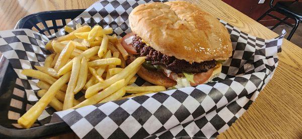 Bacon cheese burger with jalapenos and fries combo.