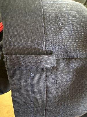 Upper rear of suit pants.