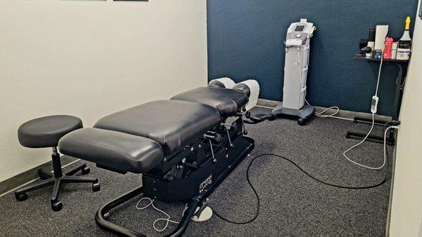 Chiropractic table and Muscle stimulation machine used in treatments