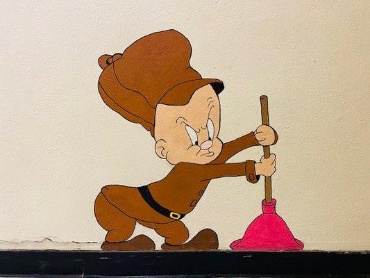 Cheeky painting of Elmer Fudd near one of the stairwells.