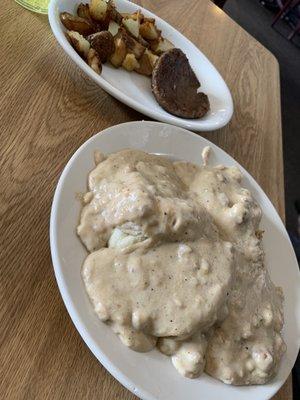 Biscuits and gravy with sausage and home fries