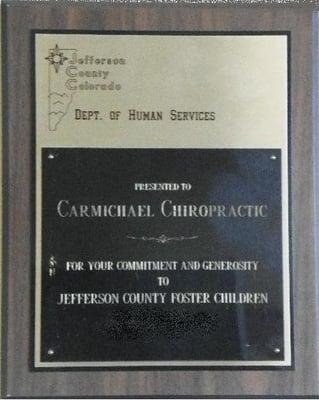 Jefferson County Foster Care Unit bestowed Dr. Carmichael an award for his annual toy drive for these deserving children.