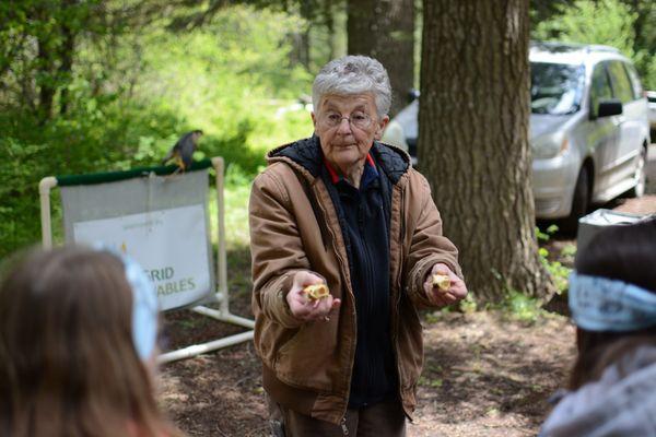 Lynn educating middle school students about local raptors.