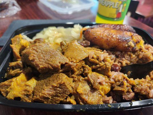 Curry Goat with cabbage rice and plantains