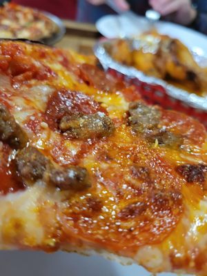 Pepperoni and sausage pizza close up. So good!