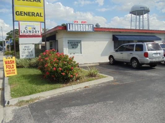 The laundromat is next to BP gas station and Dollar General