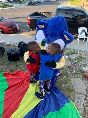 Birthday boys hugging Sonic